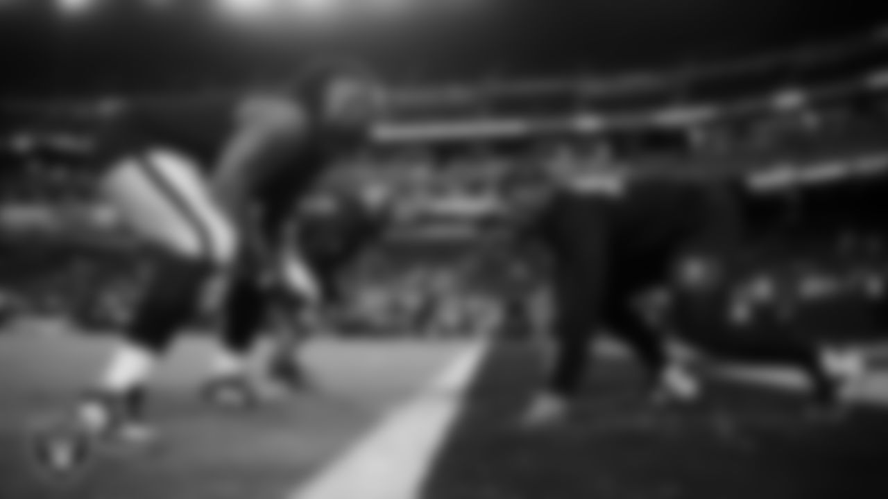Las Vegas Raiders defensive tackle Adam Butler (69) and defensive tackle Thomas Booker IV (99) warming up before the regular season home game against the Dallas Cowboys at Allegiant Stadium.