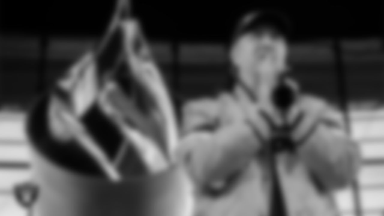 Las Vegas Raiders fan and Guinness World Record holder Brian Fowler lights the Al Davis Memorial Torch before the Las Vegas Raiders' regular season home game against the Kansas City Chiefs at Allegiant Stadium.