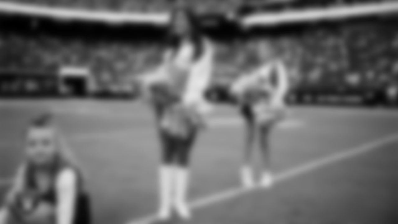Raiderette Tatiana and Junior Raiderettes perform on the field before the preseason home game against the San Francisco 49ers at Allegiant Stadium.