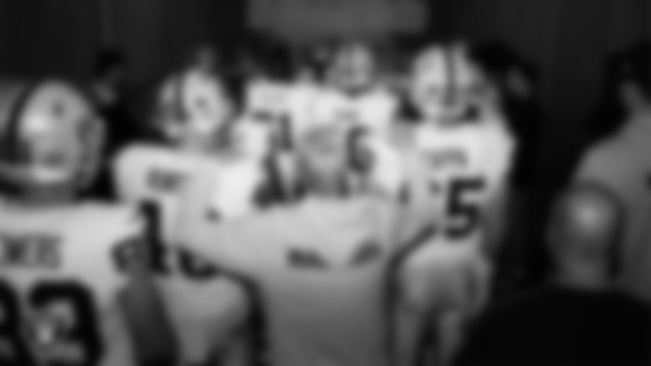The Las Vegas Raiders wait to be introduced onto the field before the regular season away game against the Houston Texans at NRG Stadium.