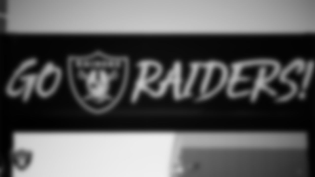 Las Vegas Raiders signage on the field for practice at 2025 Training Camp at Intermountain Health Performance Center.