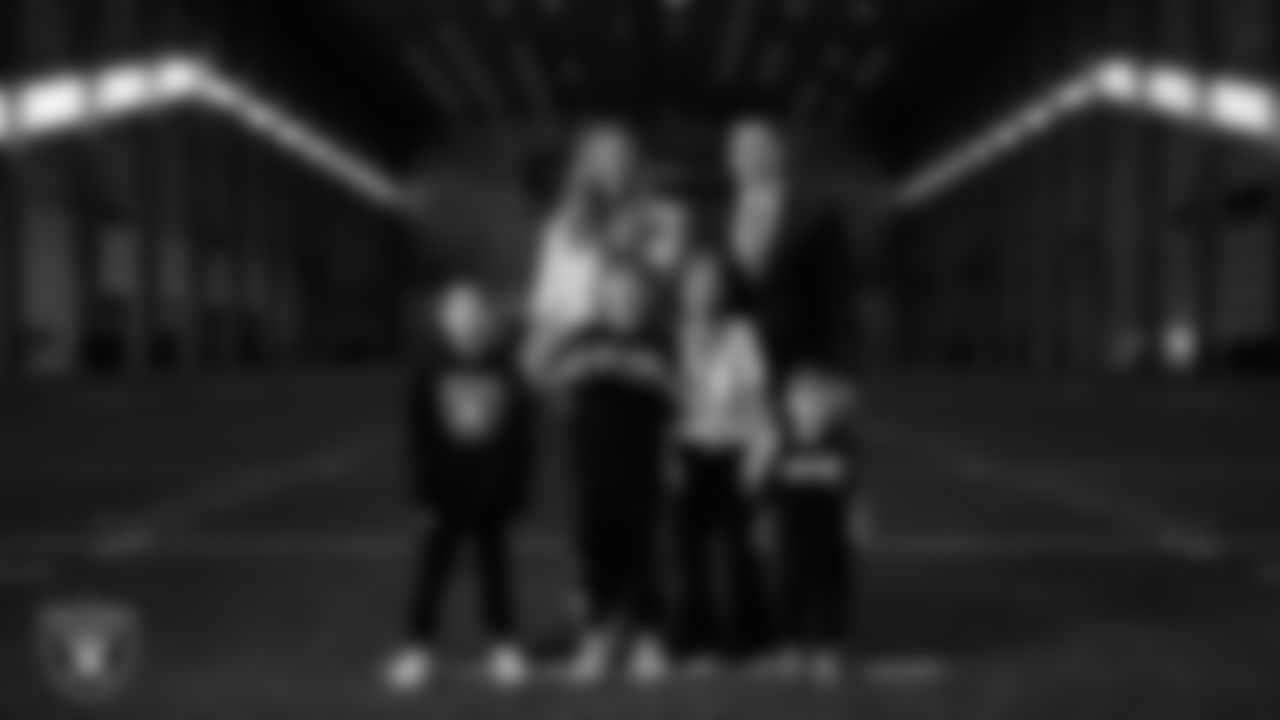 Las Vegas Raiders Head Coach Klint Kubiak and his family pose for a photo following his introductory press conference at Intermountain Health Performance Center.