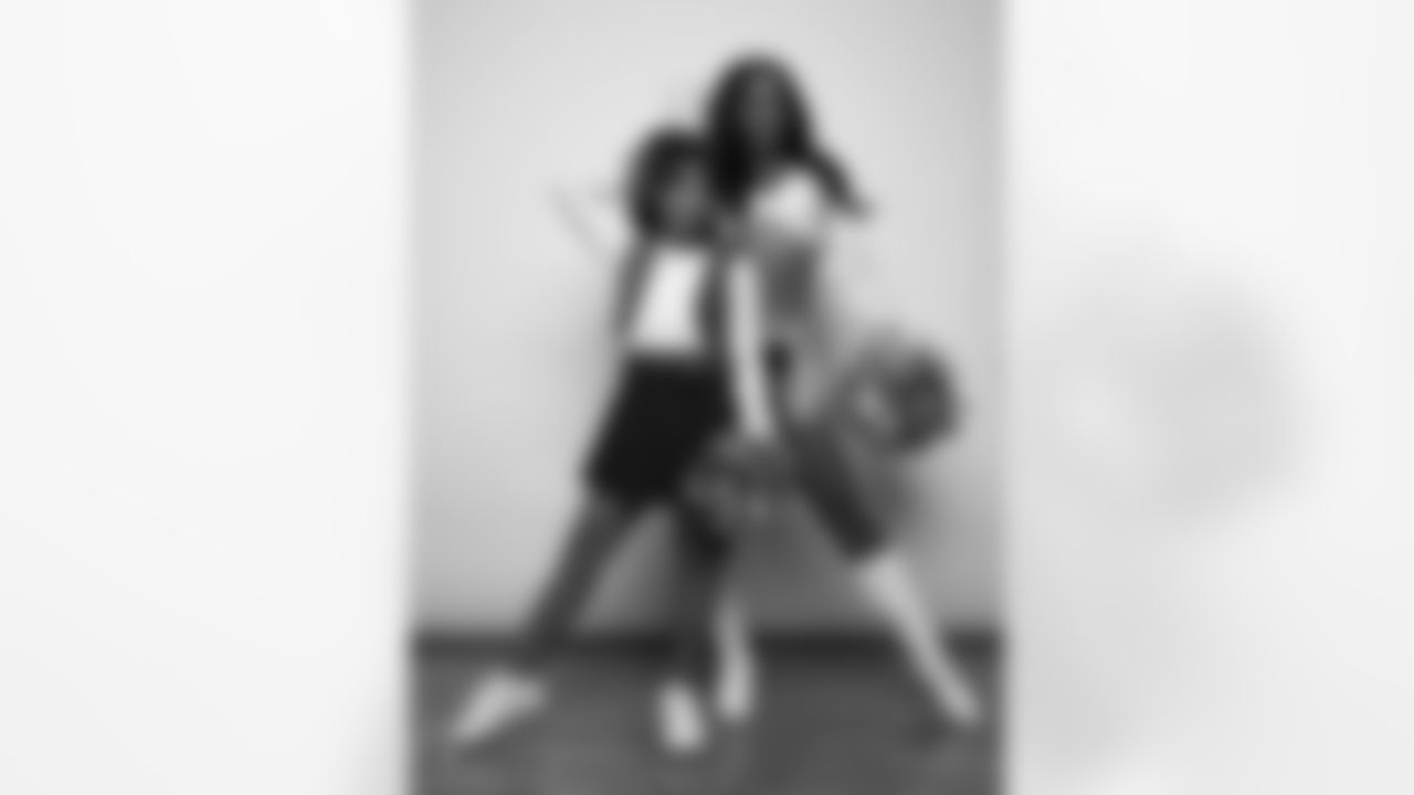 Raiderette Cierra poses for a photo with a Junior Raiderette during 2025 Media Day at The Studio.