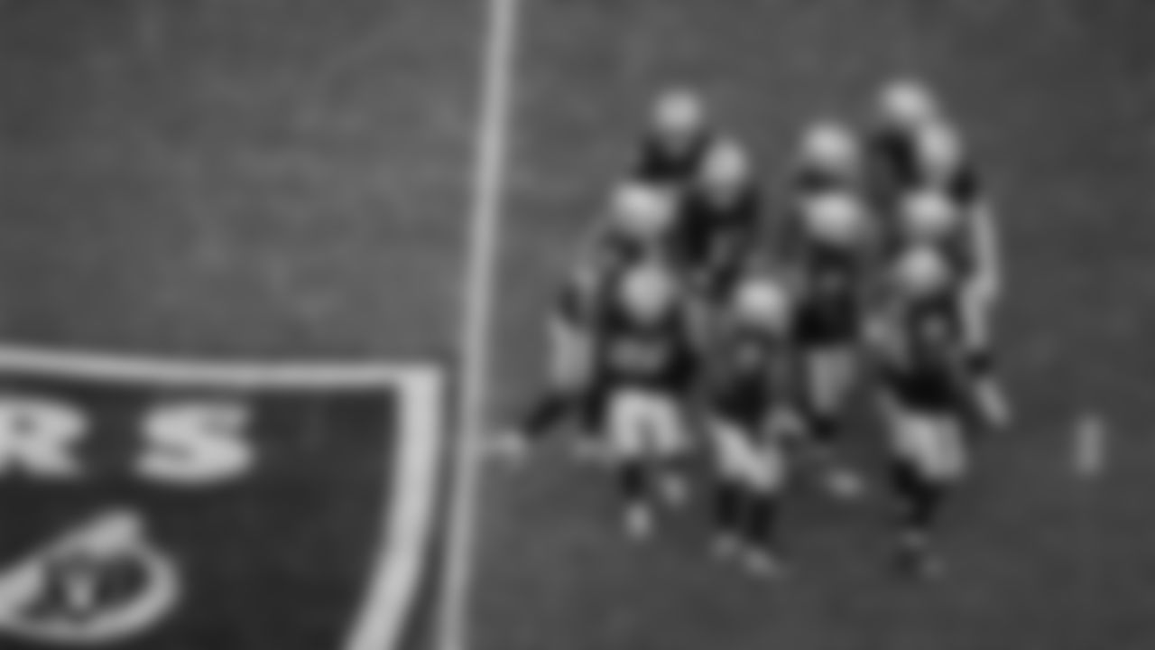 The Las Vegas Raiders defense huddles during the regular season home game against the Cleveland Browns at Allegiant Stadium.