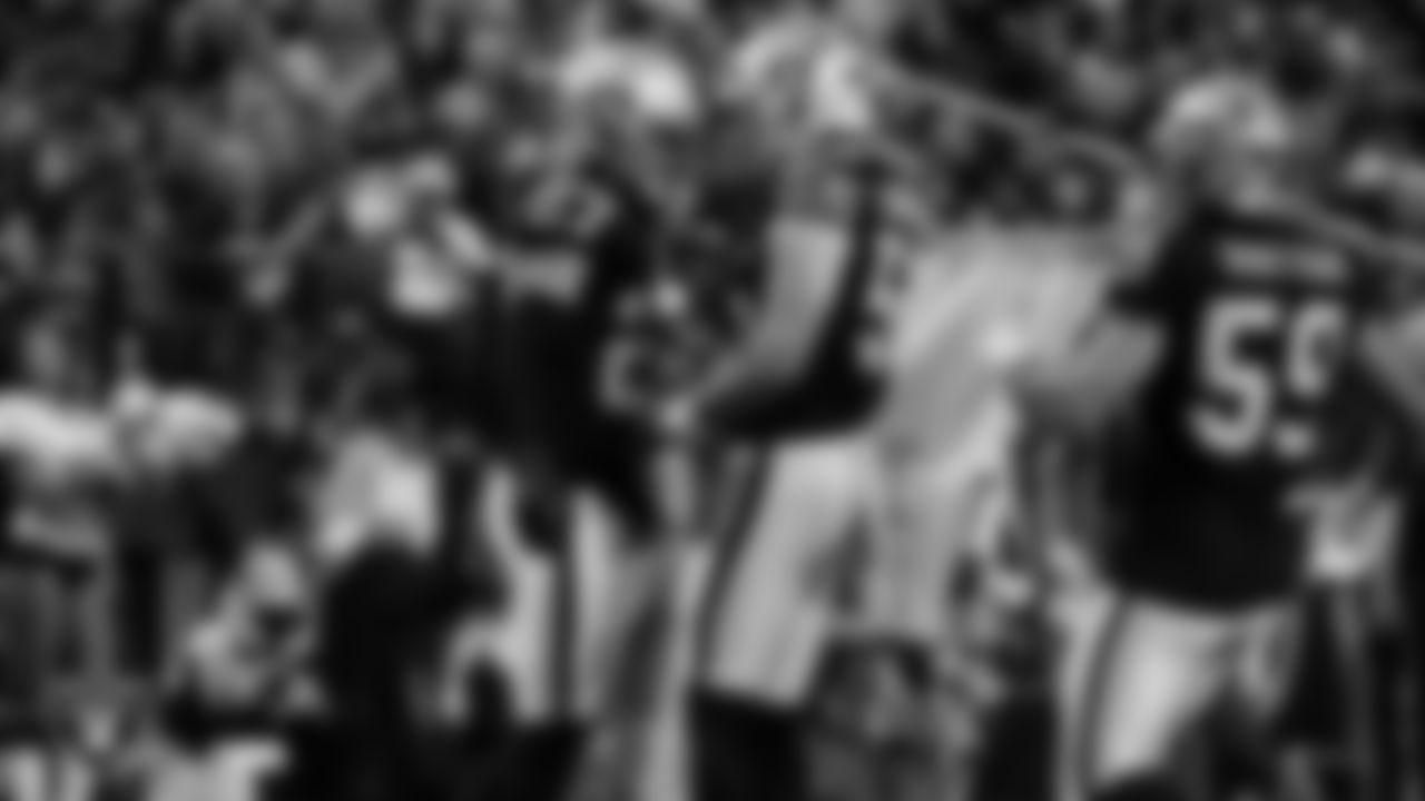 Las Vegas Raiders safety Tristin McCollum (27) celebrates with linebacker Cody Lindenberg (55) after downing a punt during the regular season home game against the Dallas Cowboys at Allegiant Stadium.