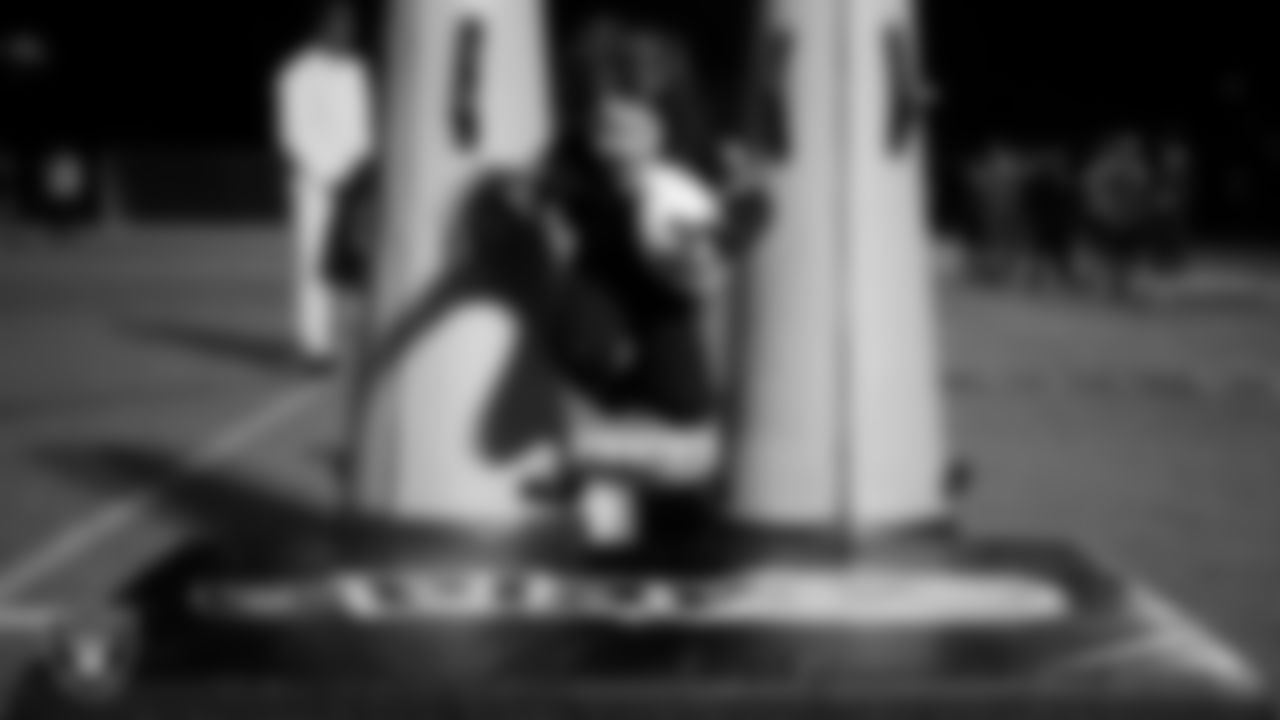 An athlete takes part in a Silver and Black League flag football clinic at Bill and Lillie Heinrich YMCA.