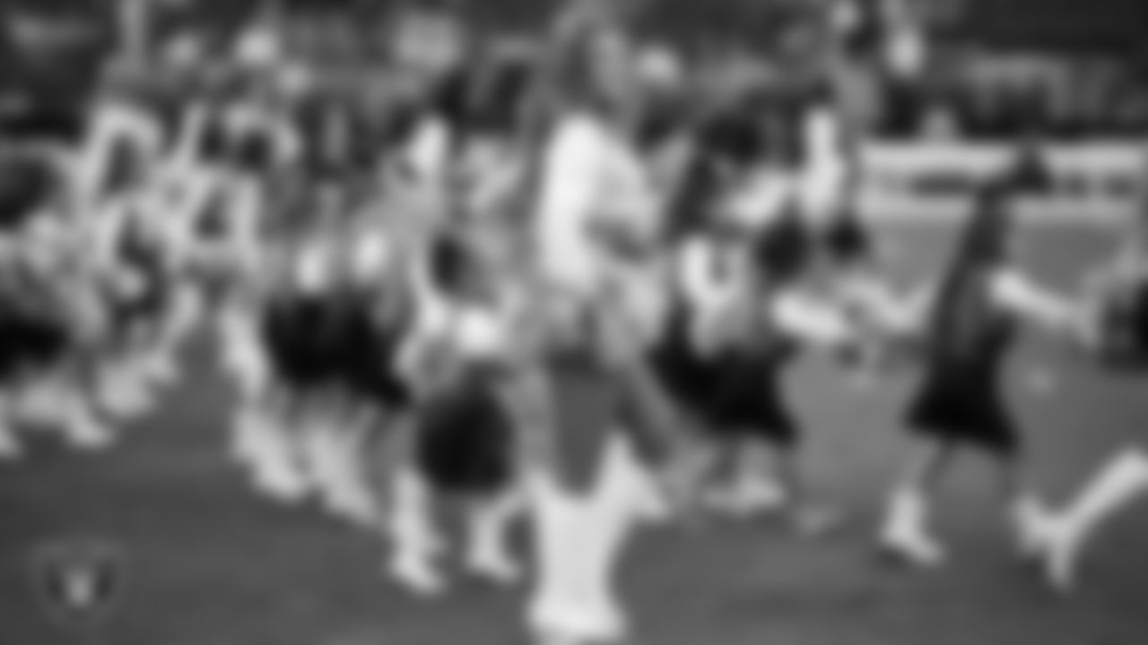 Raiderette Lexie and Junior Raiderettes enter the field for their performance on the field before the preseason home game against the San Francisco 49ers at Allegiant Stadium.