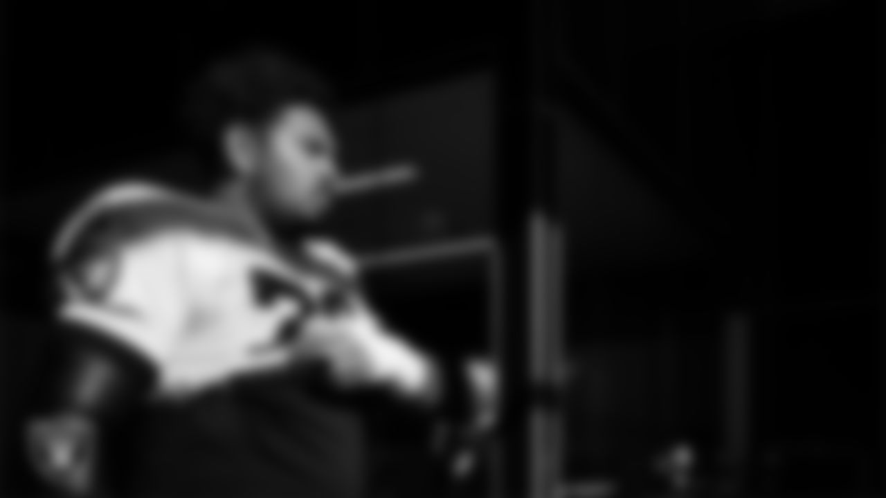 Las Vegas Raiders guard Caleb Rogers (76) walks out to the field for practice at Intermountain Health Performance Center.