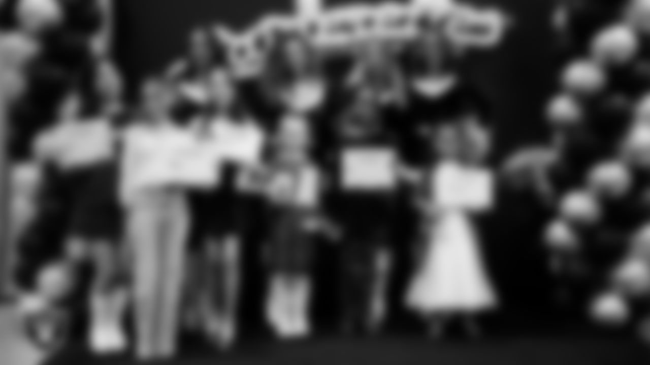 Raiderettes pose for a photo with Junior Raiderettes during the Junior Raiderettes Banquet at The Studio.