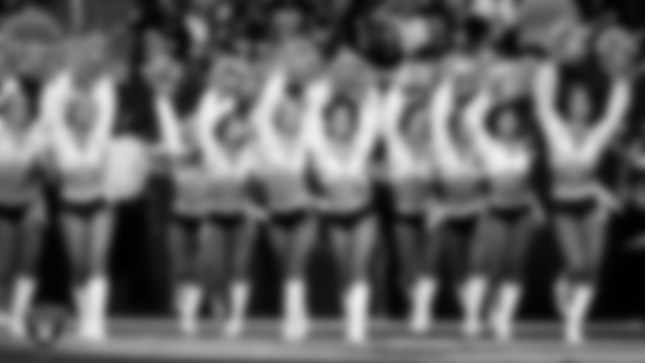 The Raiderettes walk onto the field for a performance during the regular season home game against the Los Angeles Chargers at Allegiant Stadium.