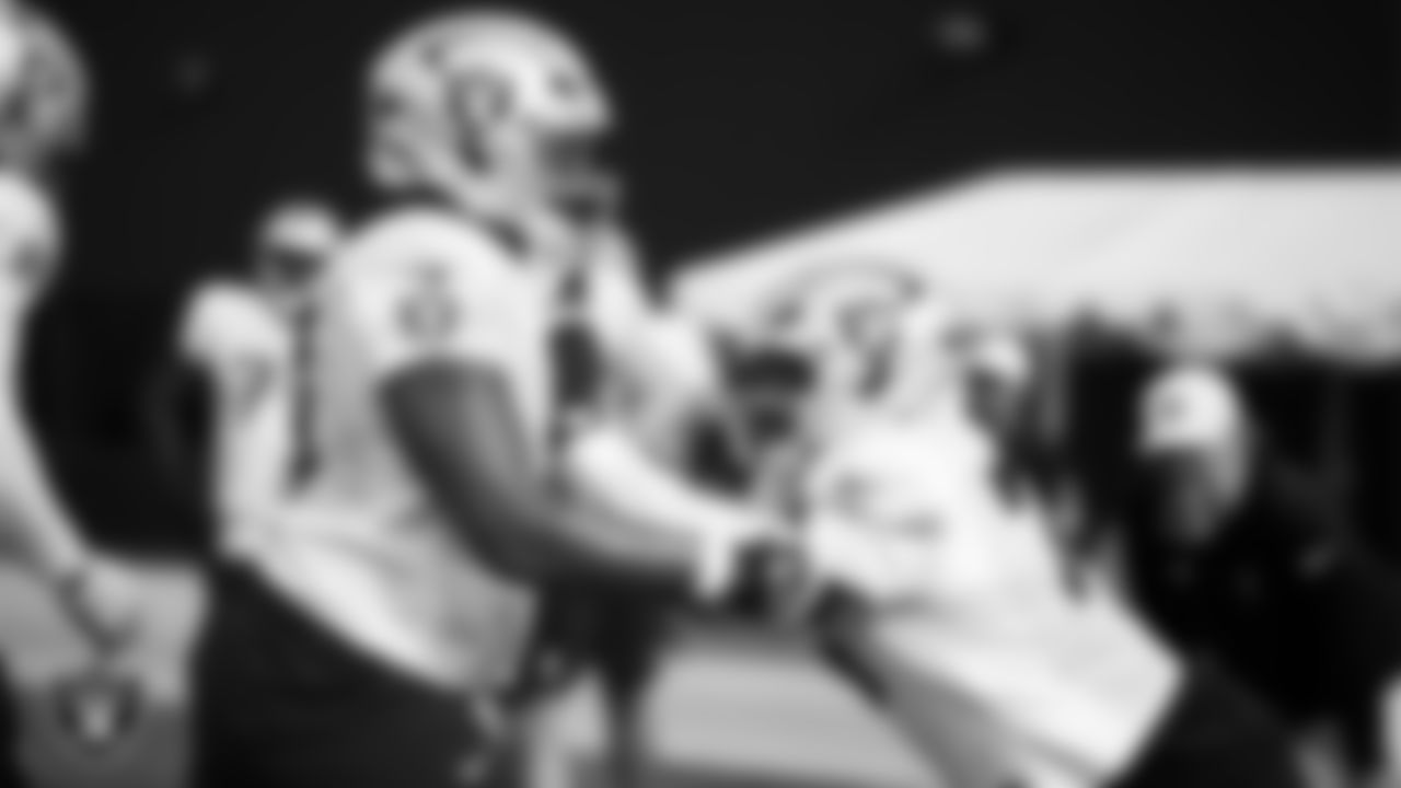 Las Vegas Raiders tackle Charles Grant (60) and guard Caleb Rogers (76) during practice at Intermountain Health Performance Center.