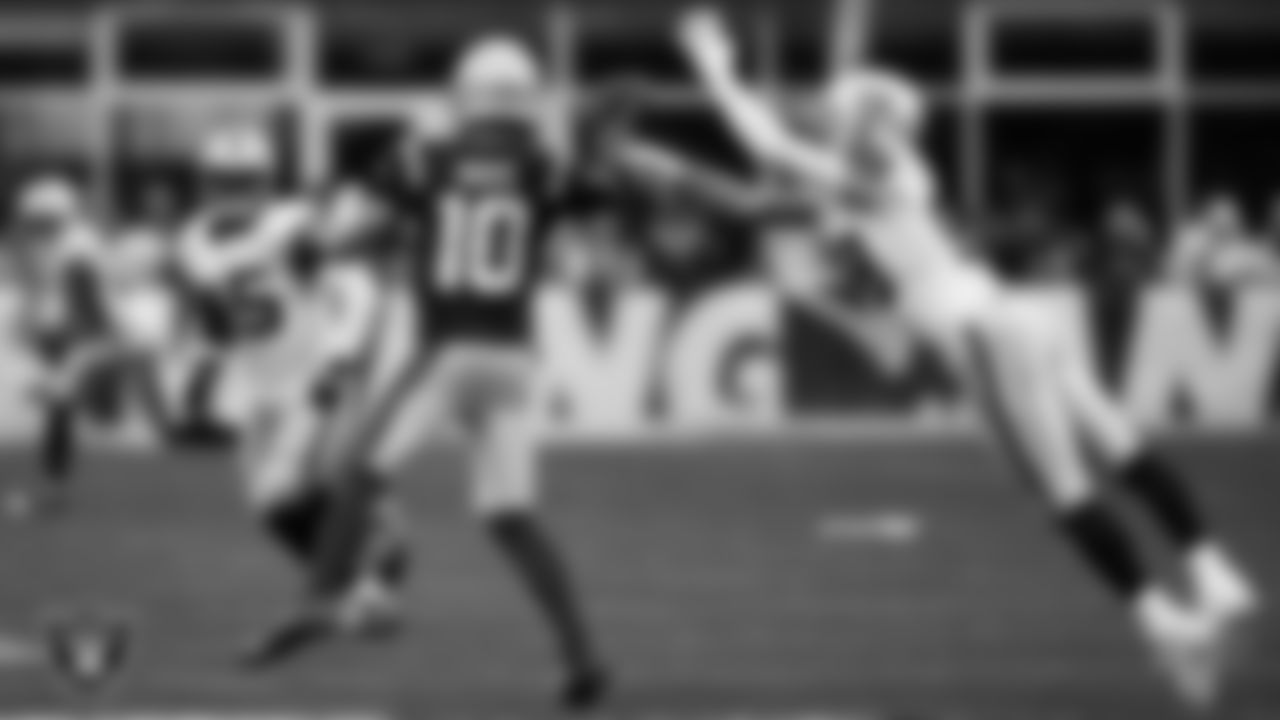 Las Vegas Raiders defensive end Maxx Crosby (98) pressures the quarterback during the regular season away game against the New England Patriots at Gillette Stadium.