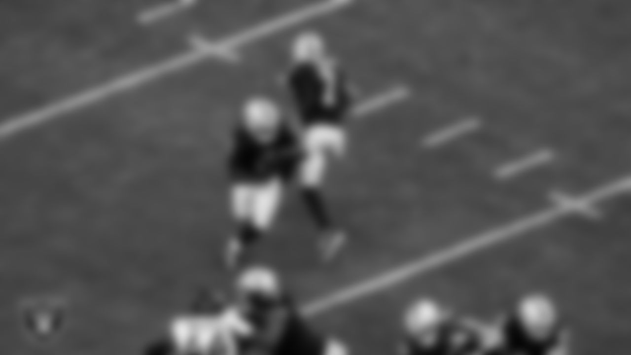Las Vegas Raiders quarterback Geno Smith (7) hands the ball off to running back Ashton Jeanty (2) during the regular season home game against the Jacksonville Jaguars at Allegiant Stadium.