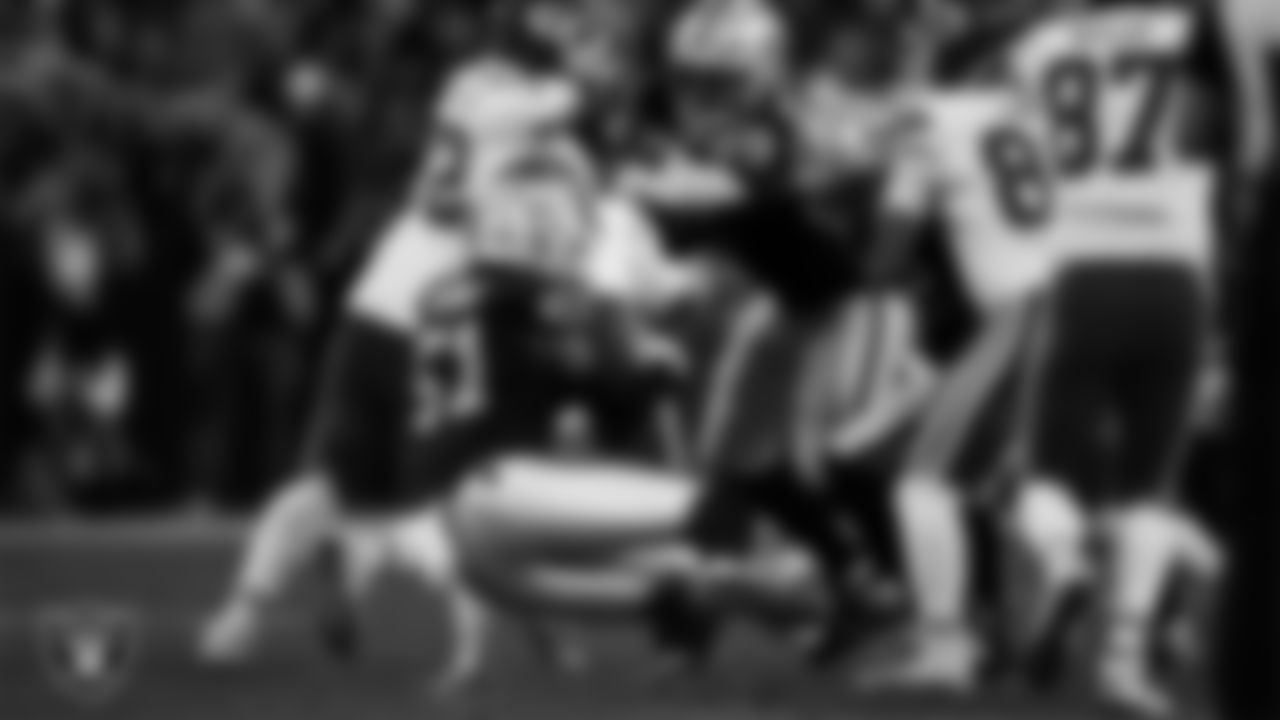 Las Vegas Raiders defensive end Malcolm Koonce (51) makes a tackle during the regular season home game against the Kansas City Chiefs at Allegiant Stadium.