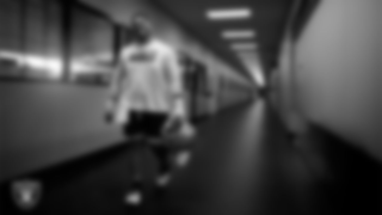 Las Vegas Raiders guard Atonio Mafi (56) walks out to the field for practice at Intermountain Health Performance Center.