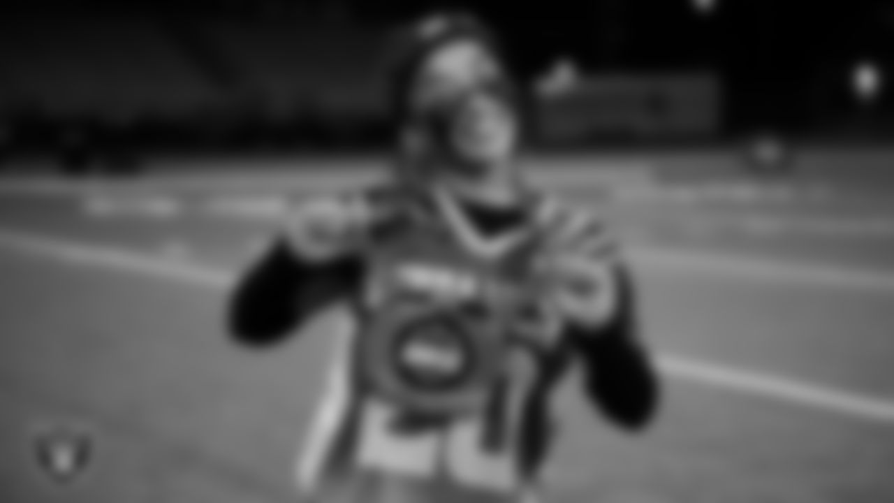 Sierra Vista High School Yauie Kahawaii Pula (20) poses for a photo with the MPV chain after the Raiders' High School Flag Football Showcase game at Sierra Vista High School.