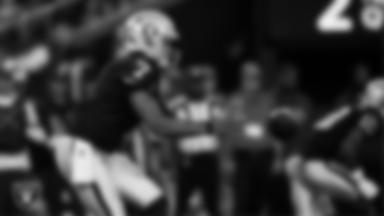 Las Vegas Raiders quarterback Geno Smith (7) receives the snap during the regular season home game against the Dallas Cowboys at Allegiant Stadium.