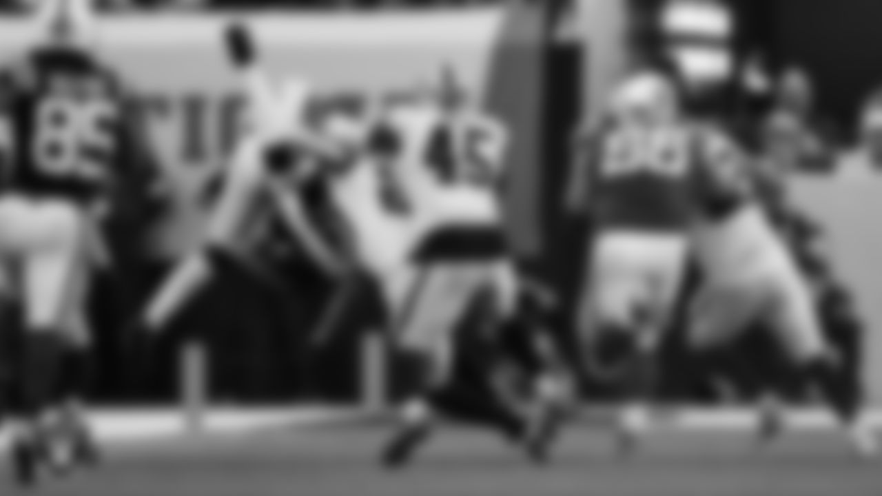 Las Vegas Raiders safety Isaiah Pola-Mao (20) makes a tackle during the regular season away game against the Indianapolis Colts at Lucas Oil Stadium.