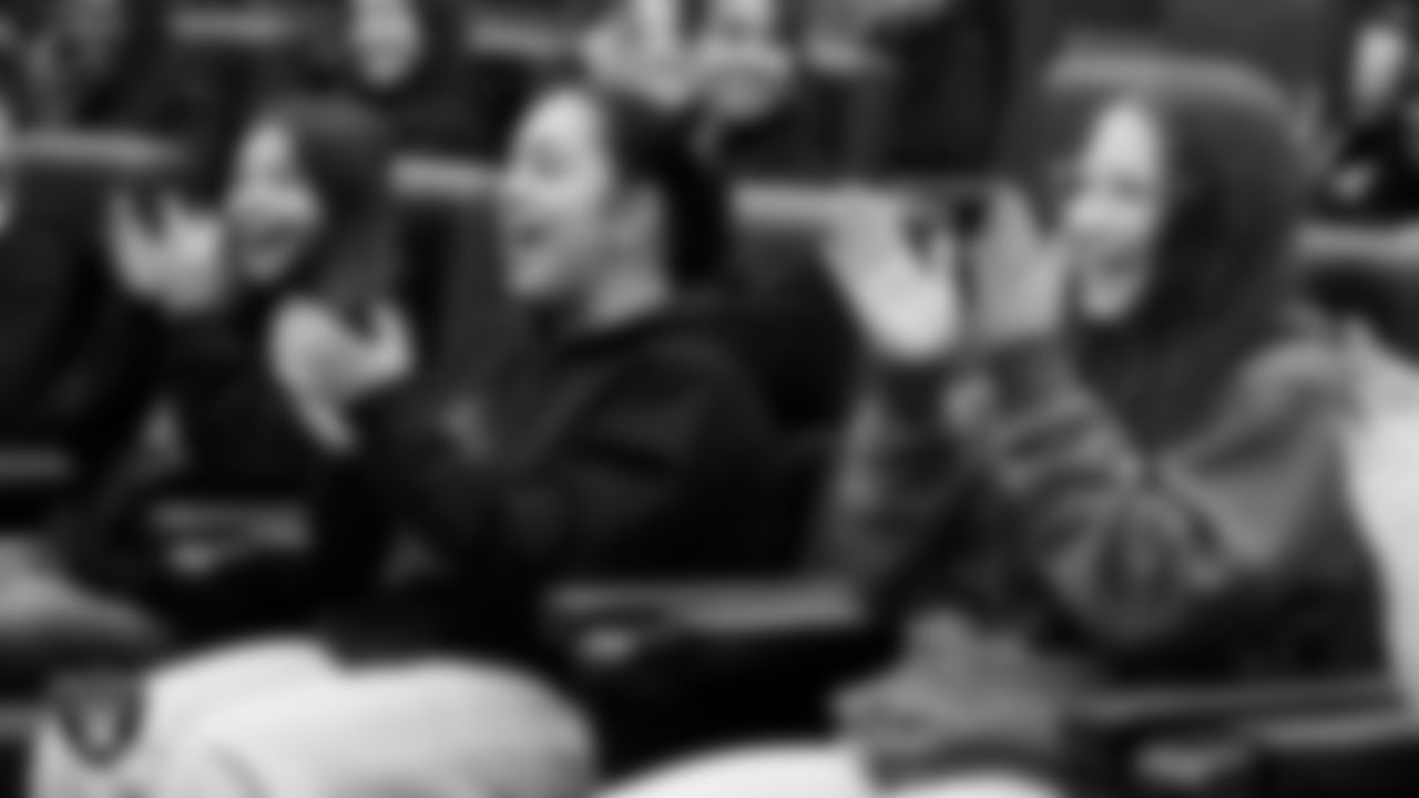 Athletes from Clark High School and Chaparral High School react after being told they are getting all new flag football uniforms and equipment at Intermountain Health Performance Center.