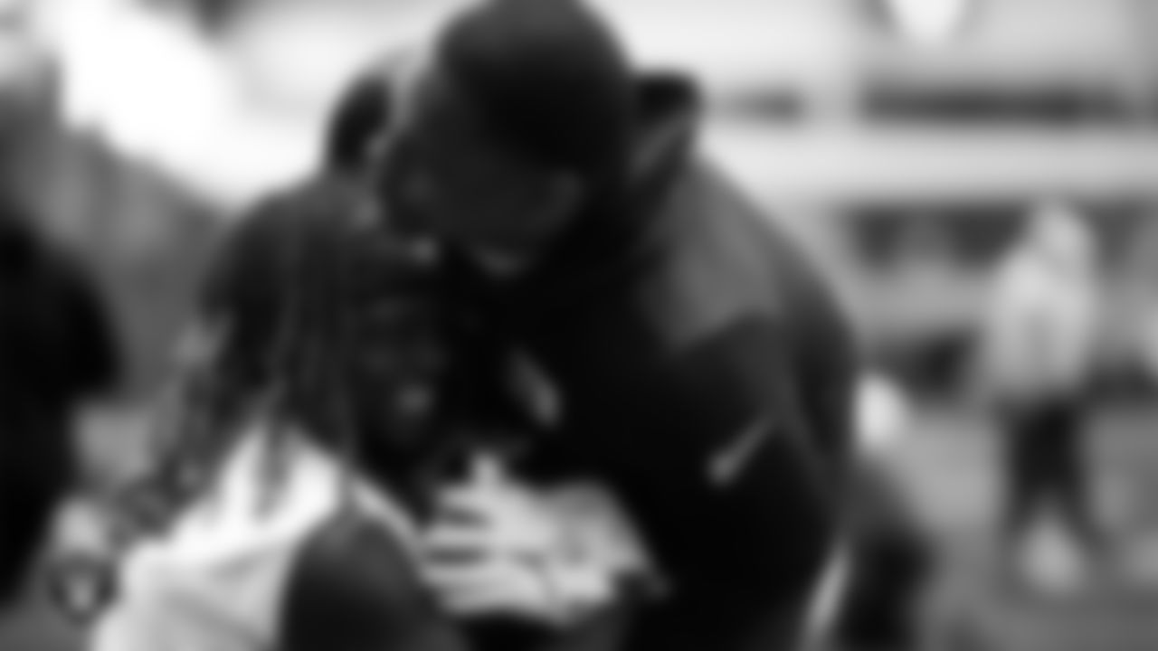Las Vegas Raiders running back Ashton Jeanty (2) and defensive assistant/linebackers coach Ty McKenzie at an Organized Team Activity (OTA) at Intermountain Health Performance Center.