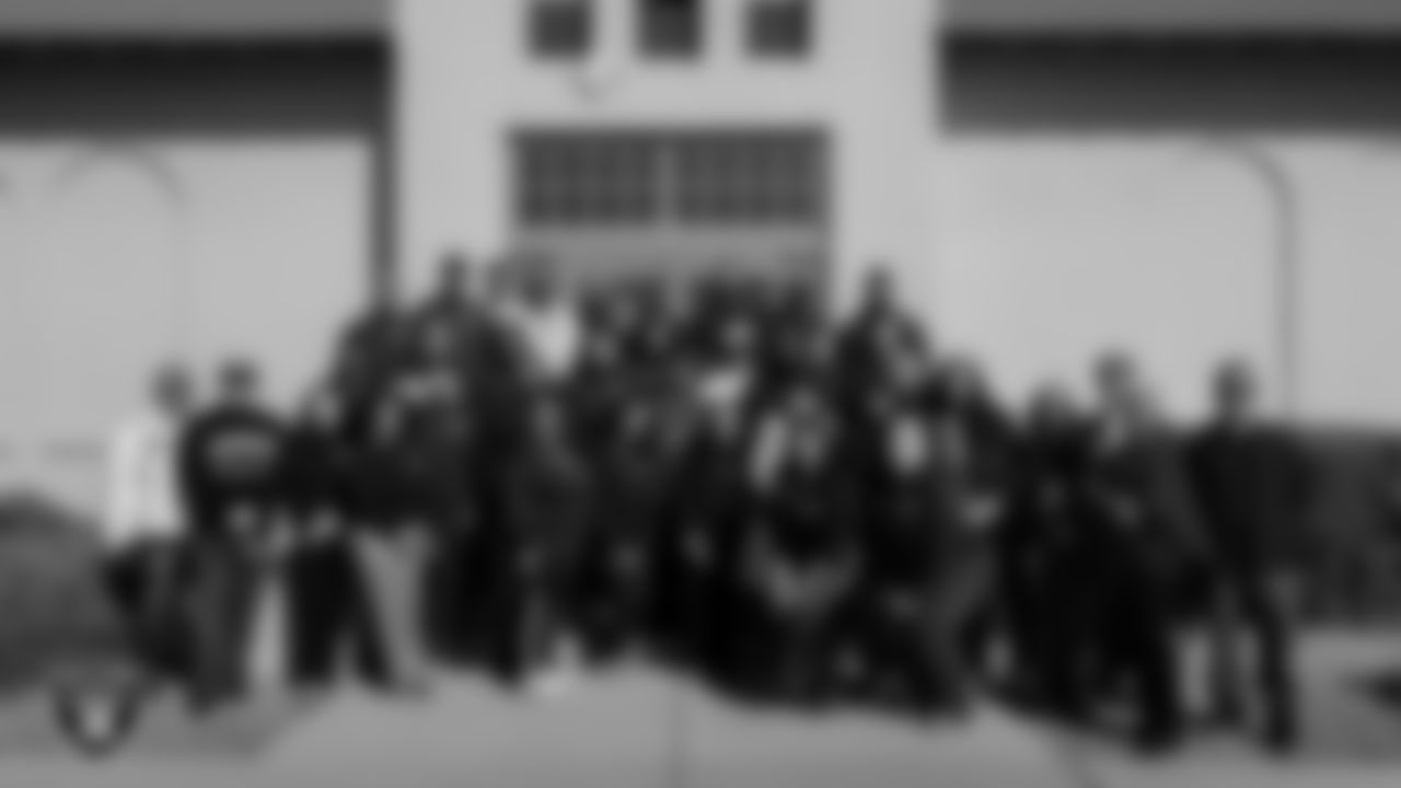 Attendees pose for a photo in front of the Historic Westside School during the Historic Westside Tour.