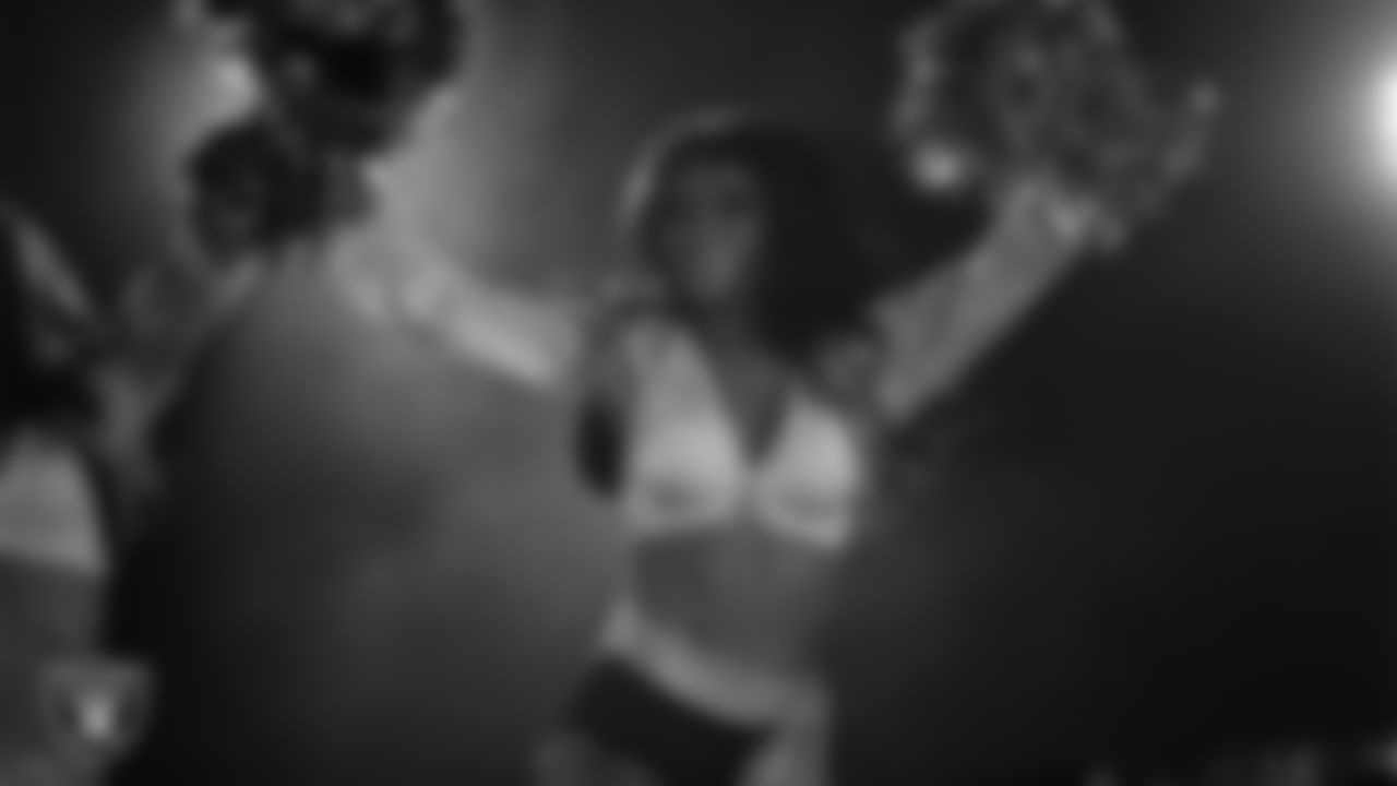 Raiderette Kylee performs with Rapper Nelly at halftime during the regular season home game against the Dallas Cowboys at Allegiant Stadium.