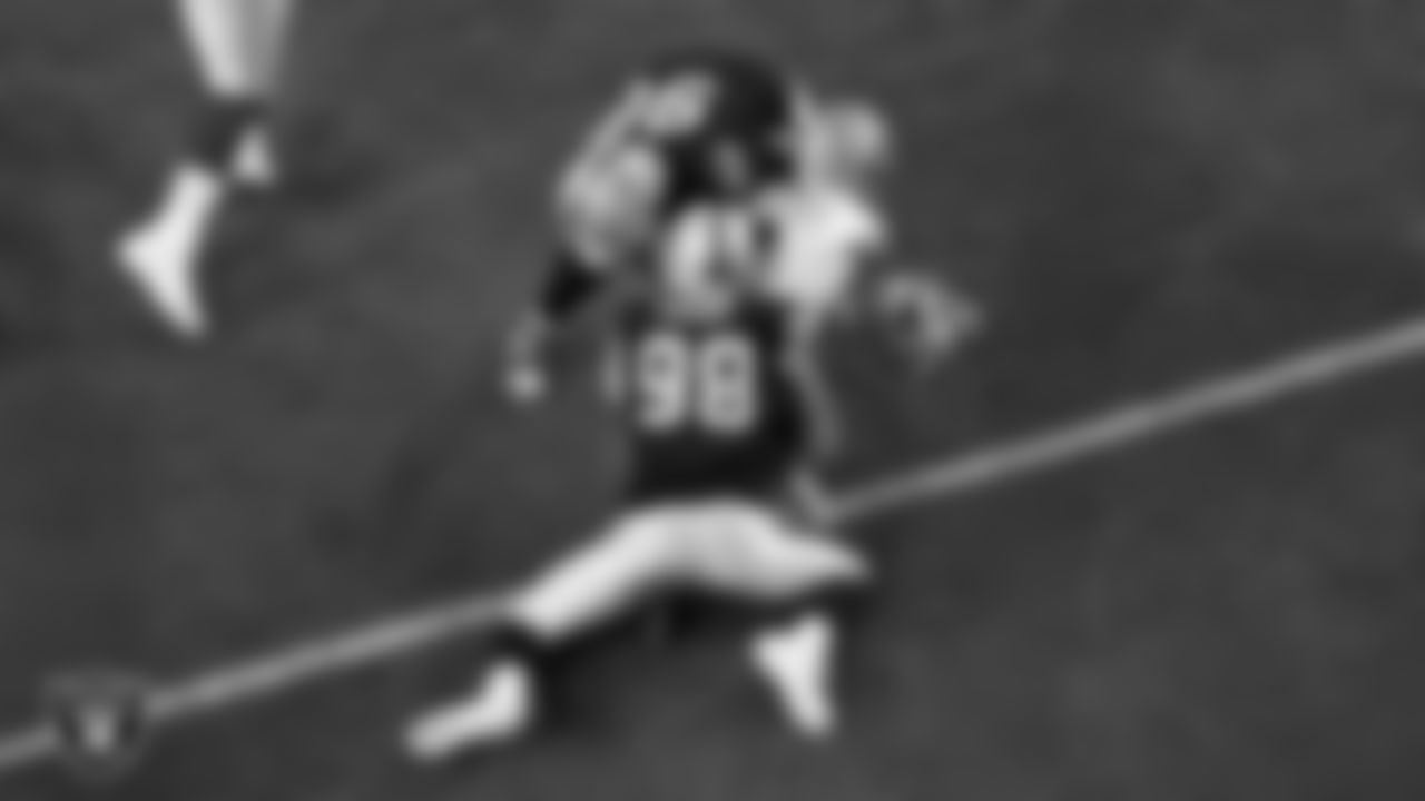 Las Vegas Raiders defensive end Maxx Crosby (98) forces a fumble during the regular season home game against the Dallas Cowboys at Allegiant Stadium.