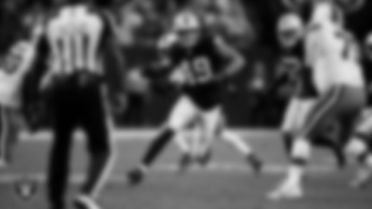 Las Vegas Raiders defensive end Charles Snowden (49) runs after making an interception during the regular season home game against the Cleveland Browns at Allegiant Stadium.