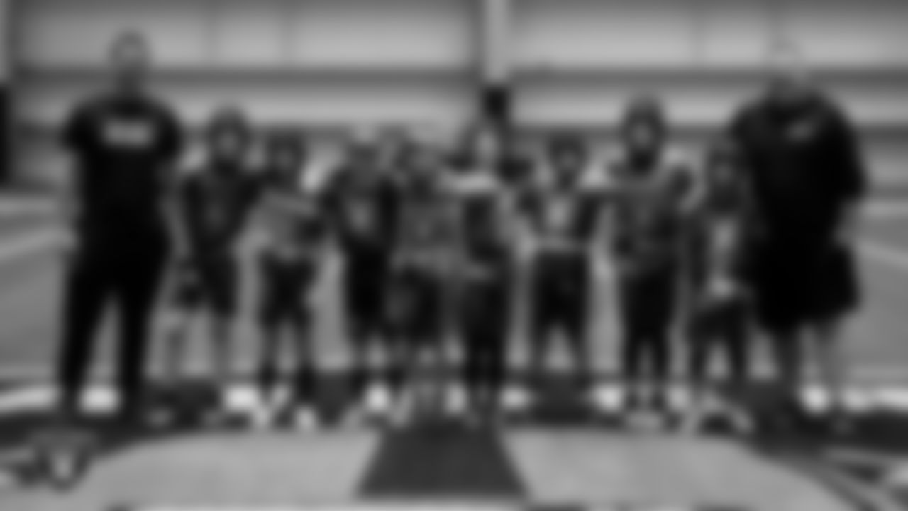 The 8U Empire flag football team poses for a photo during an open practice at at Intermountain Health Performance Center.