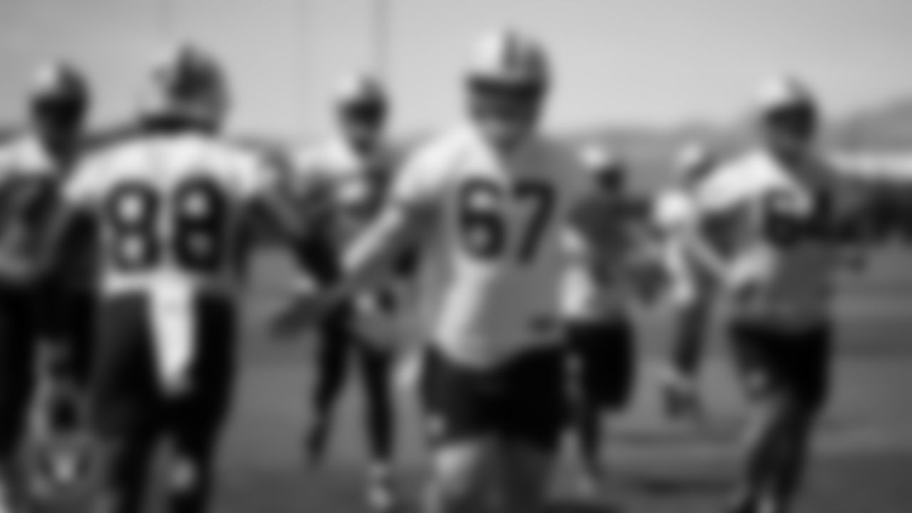 Las Vegas Raiders tight end Justin Shorter (88) and center Will Putnam (67) on the field for mandatory minicamp at Intermountain Health Performance Center.
