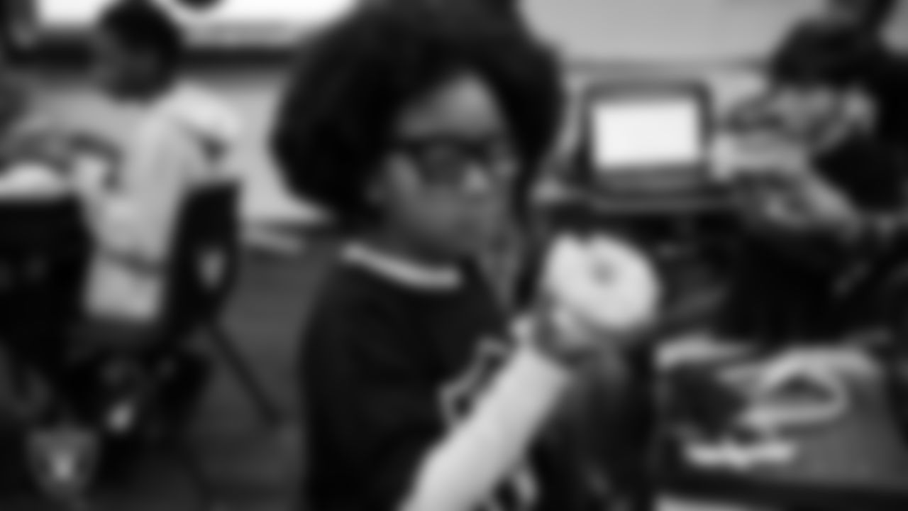 A student celebrates winning the Lil' Raiders School Challenge at Matt Kelly Elementary School.