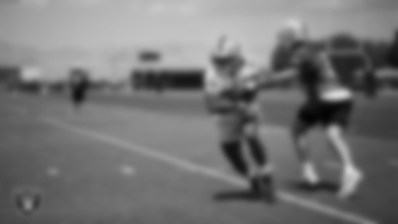 Las Vegas Raiders running back Chris Collier (33) and quarterback Cam Miller (5) at an Organized Team Activity (OTA) at Intermountain Health Performance Center.