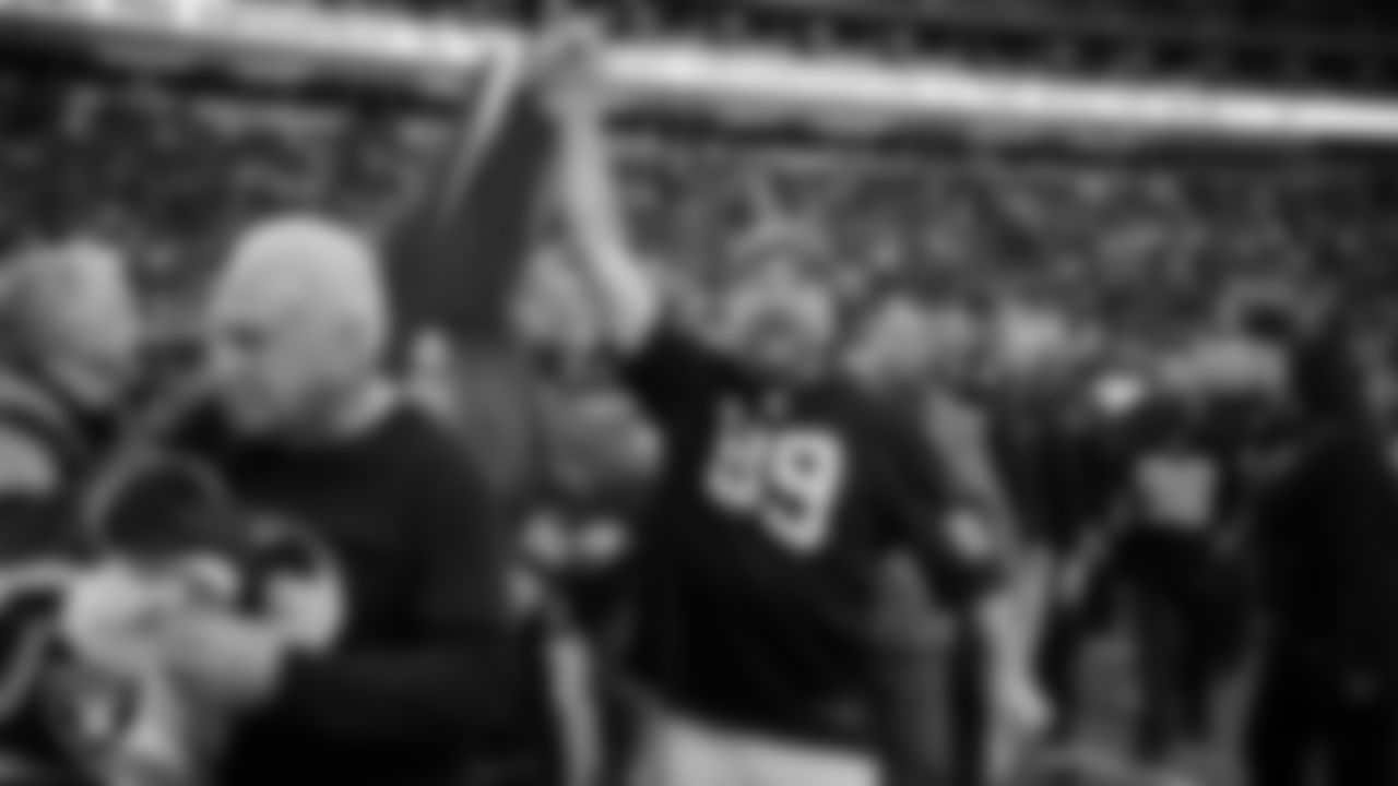 The American flag is displayed by Personal Seat License (PSL) holders on the field during the national anthem before the Las Vegas Raiders' regular season home game against the Cleveland Browns at Allegiant Stadium.