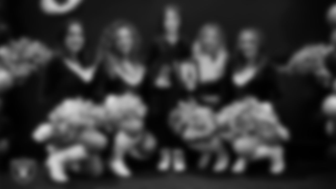 Raiderettes pose for a photo with a Junior Raiderette during the Junior Raiderettes Banquet at The Studio.