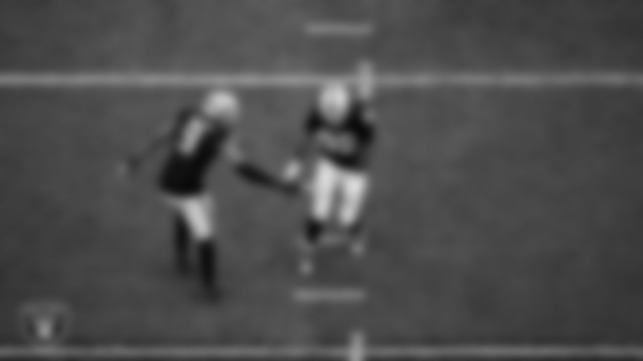 Las Vegas Raiders defensive tackle Jonah Laulu (96) celebrates with defensive end Tyree Wilson (9) after sacking the quarterback during the regular season home game against the Tennessee Titans at Allegiant Stadium.