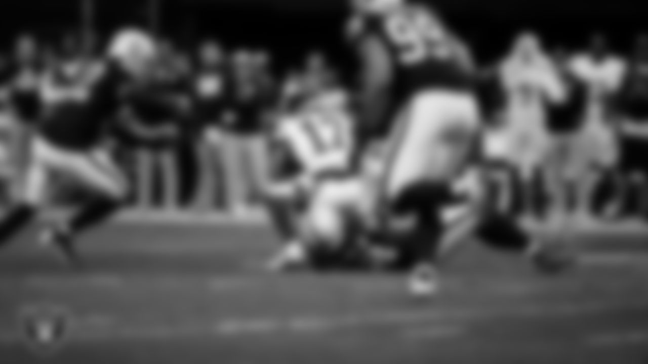 Las Vegas Raiders safety Lonnie Johnson Jr. (32) makes a tackle during the regular season home game against the New York Giants at Allegiant Stadium.