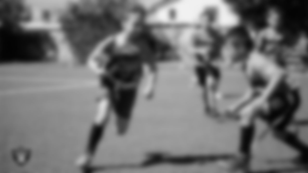 Athletes compete in a Silver and Black Flag Football game at Bill and Lillie Heinrich YMCA.