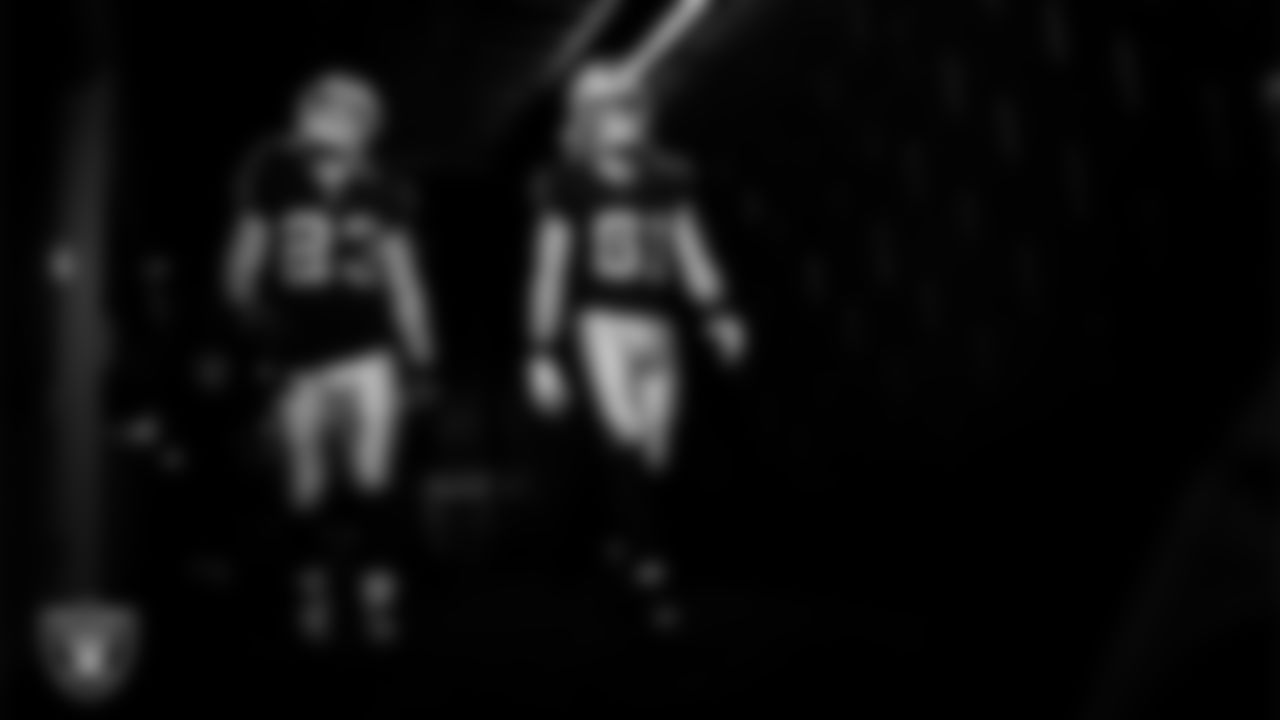 Las Vegas Raiders running back Dylan Laube (23) and wide receiver Alex Bachman (81) walk down the tunnel before the regular season home game against the Kansas City Chiefs at Allegiant Stadium.