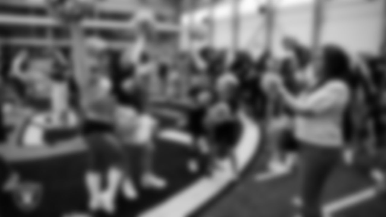 Raiderette Taylor poses for a photo with a dancer during day three of summer camp at Intermountain Health Performance Center.