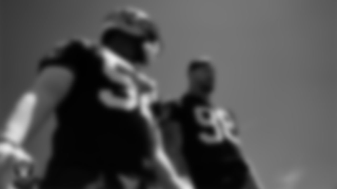 Las Vegas Raiders linebacker Elandon Roberts (52) and defensive end Maxx Crosby (98) at an Organized Team Activity (OTA) at Intermountain Health Performance Center.