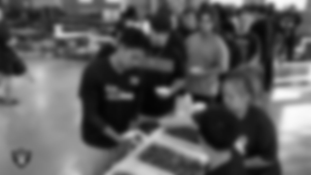 The Spring Valley High School football team grabs a meal after practice at Spring Valley High School.