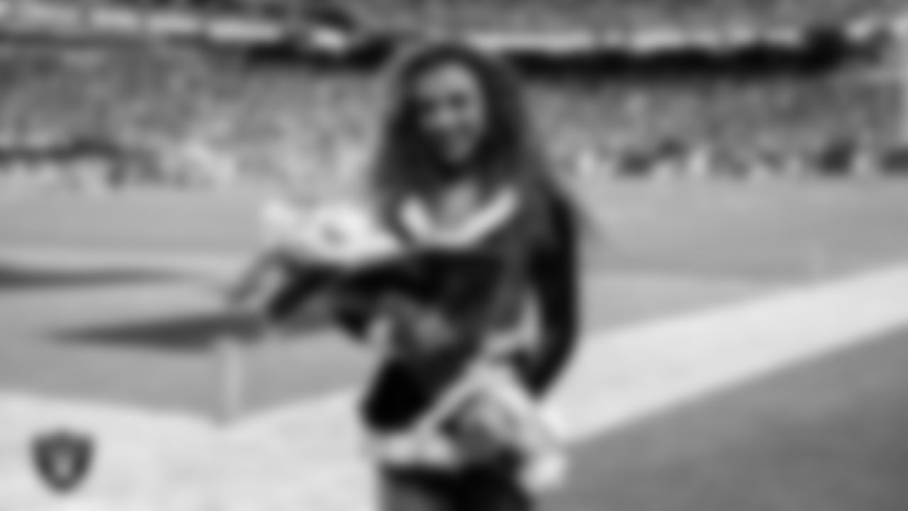 Raiderette Lexie poses for a photo after being named Raiderette of the Year during the regular season home game against the New York Giants at Allegiant Stadium.