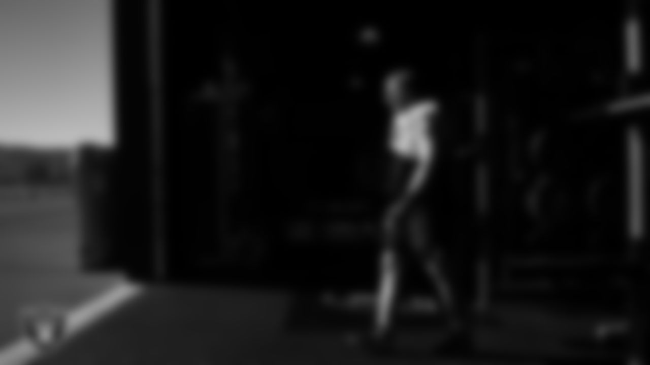 Las Vegas Raiders guard Alex Cappa (65) walks out to the field for practice at Intermountain Health Performance Center.