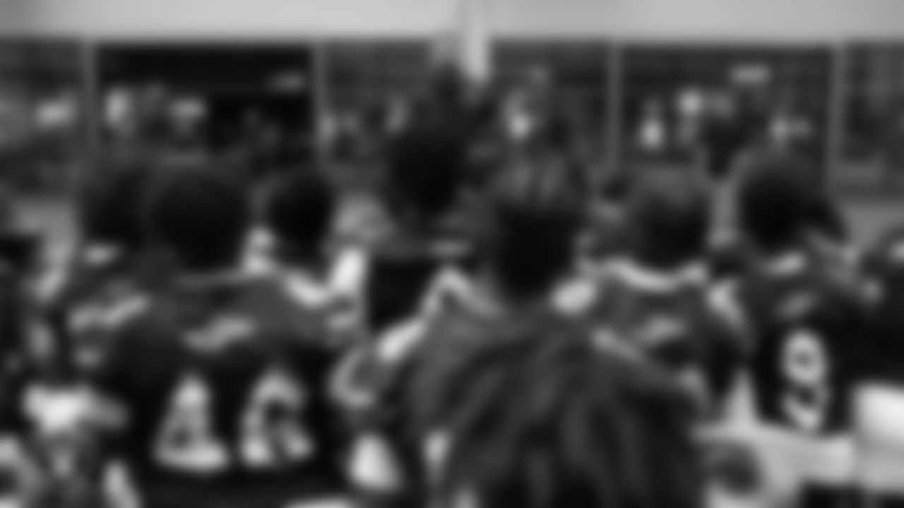 Las Vegas Raiders alumnus Teyo Johnson speaks to the Cheyenne High School football team after a walkthrough at Intermountain Health Performance Center.