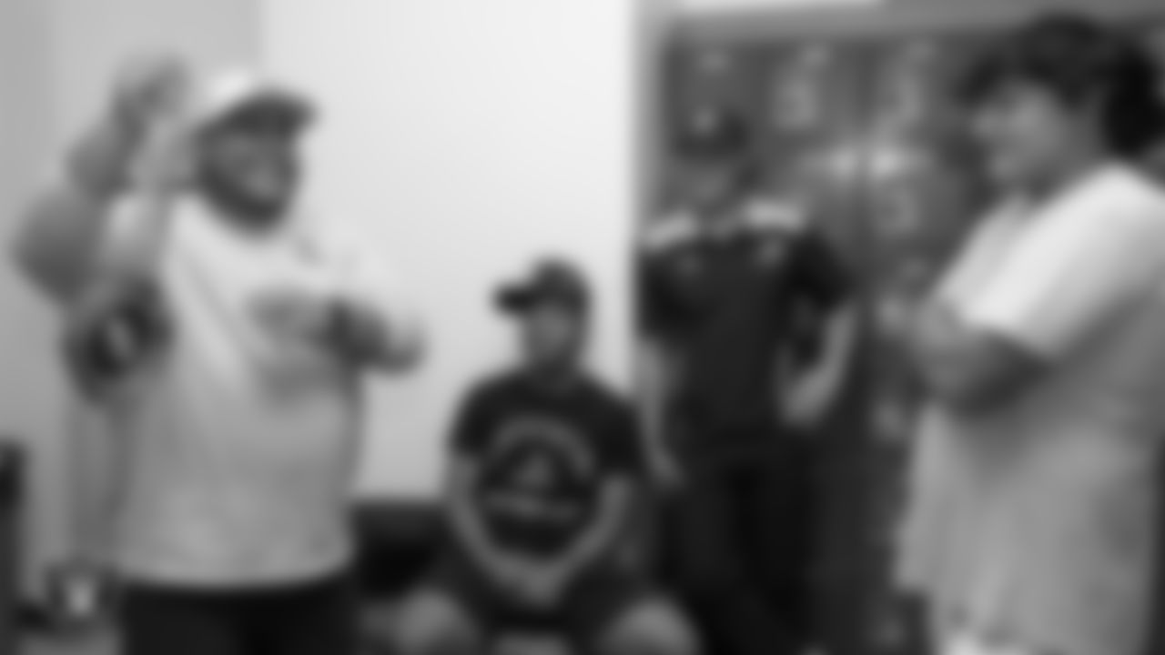 Las Vegas Raiders senior football development manager Jordan Aguilar shows off the MVP chain to the Churchill County High School football team.