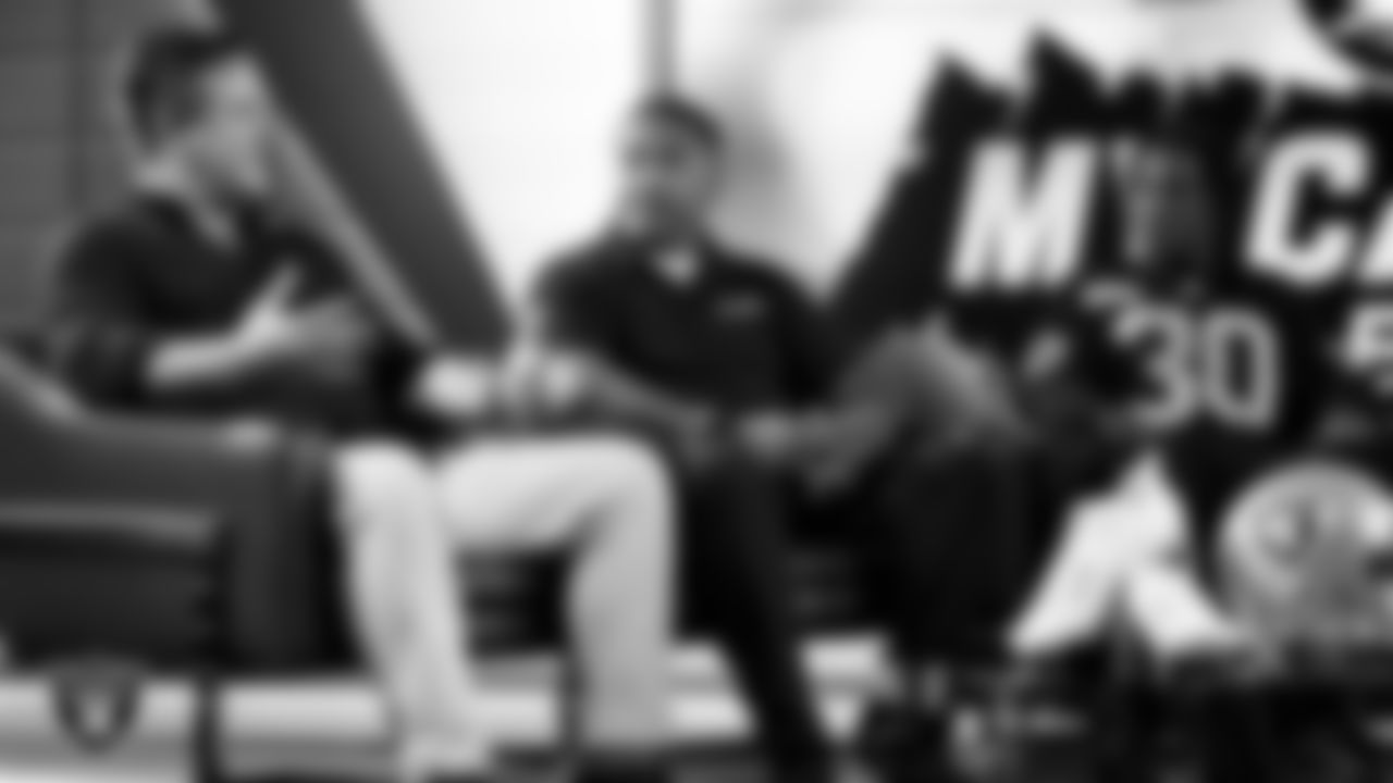 Las Vegas Raiders cornerback Darnay Holmes (30) works with representatives from Merging Vets and Players and designers to design cleats for My Cause My Cleats in Cox Studios at Intermountain Health Performance Center.