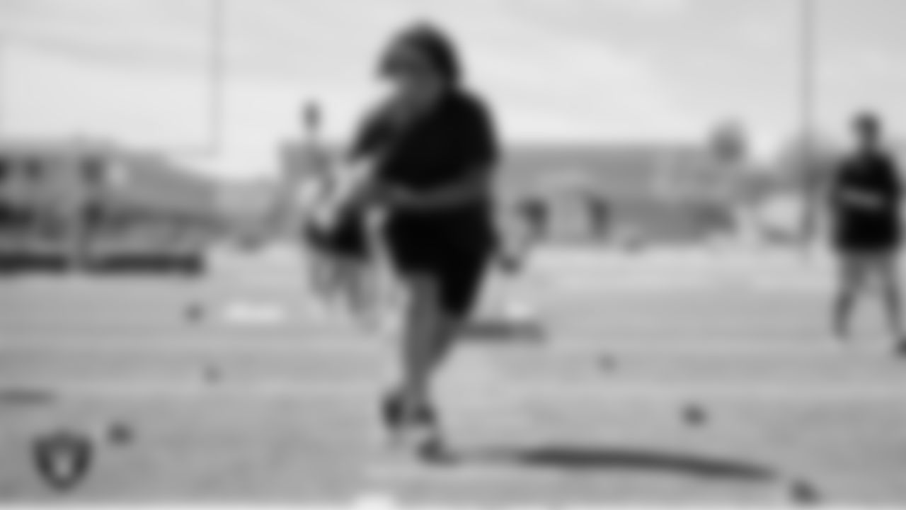 An athlete goes through a drill during a youth football combine at Durango High School.