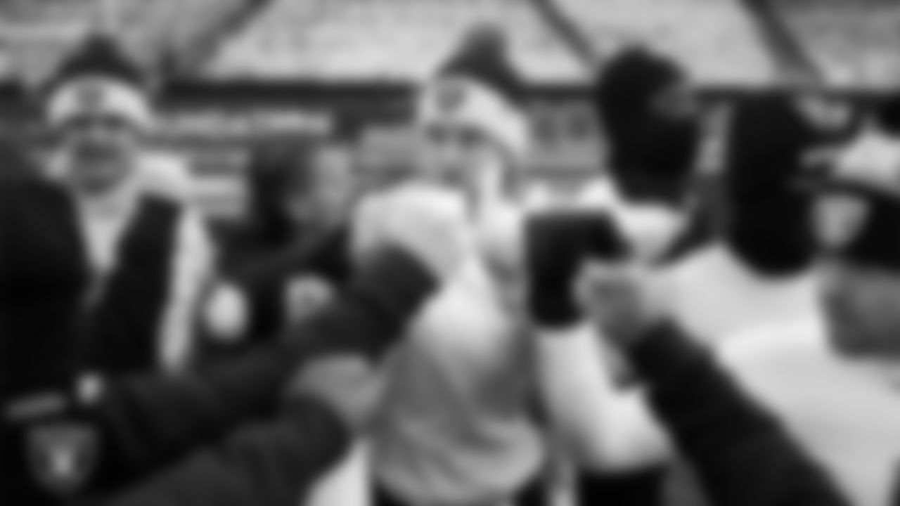 The Las Vegas Raiders quarterbacks and wide receivers huddle before the regular season away game against the Philadelphia Eagles at Lincoln Financial Field.