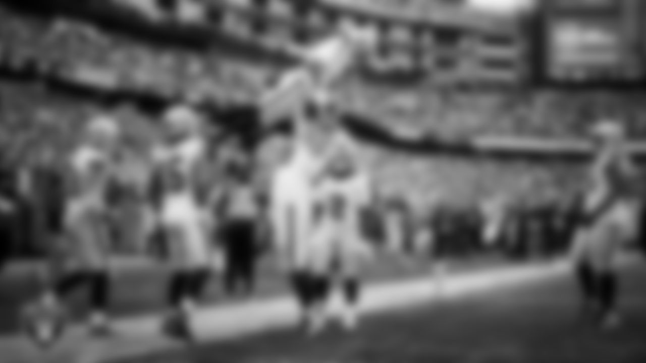 Las Vegas Raiders wide receiver Tre Tucker (1) celebrates with center Jackson Powers-Johnson (58) after making a 26-yard touchdown catch during the regular season away game against the New England Patriots at Gillette Stadium.