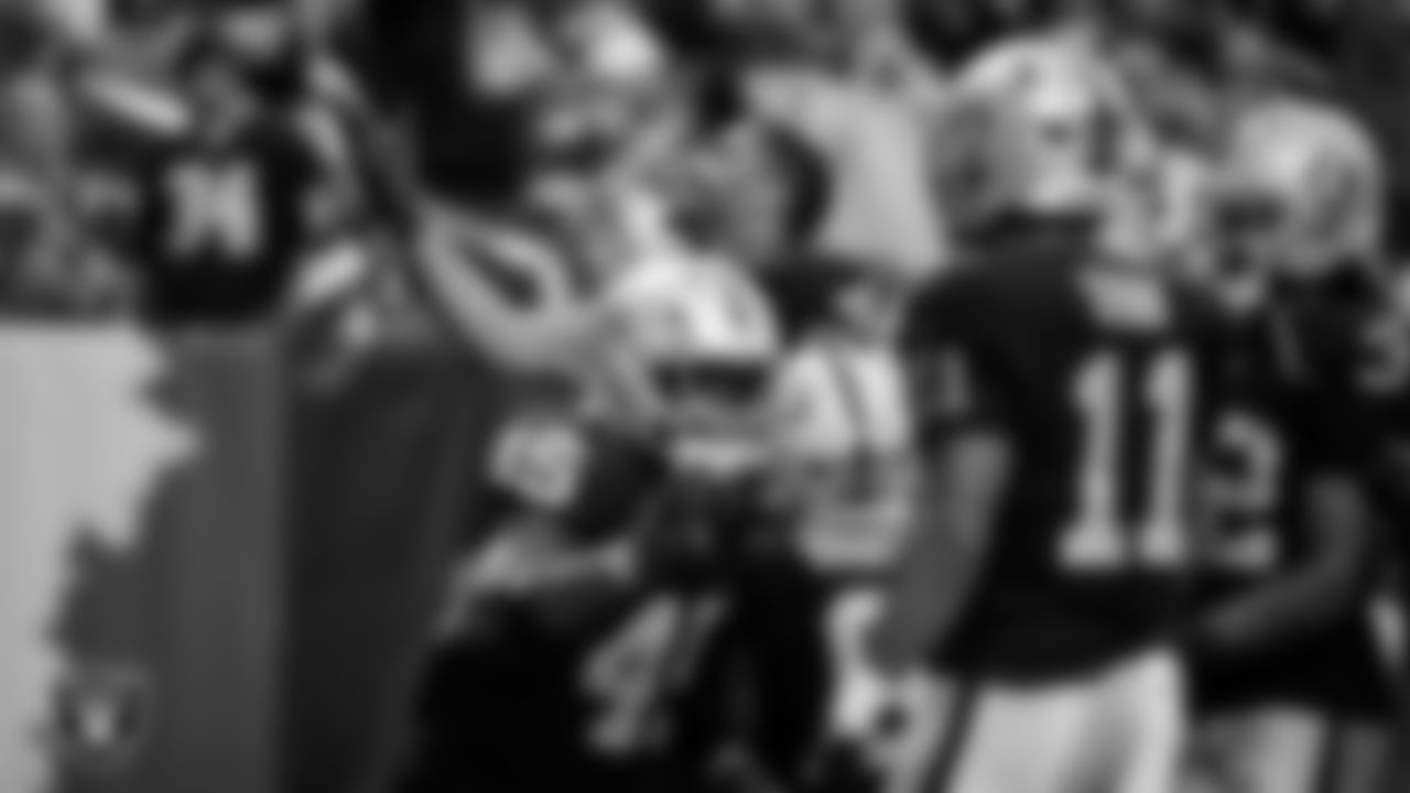 Las Vegas Raiders defensive end Charles Snowden (49) celebrates after intercepting a pass during the regular season home game against the Cleveland Browns at Allegiant Stadium.